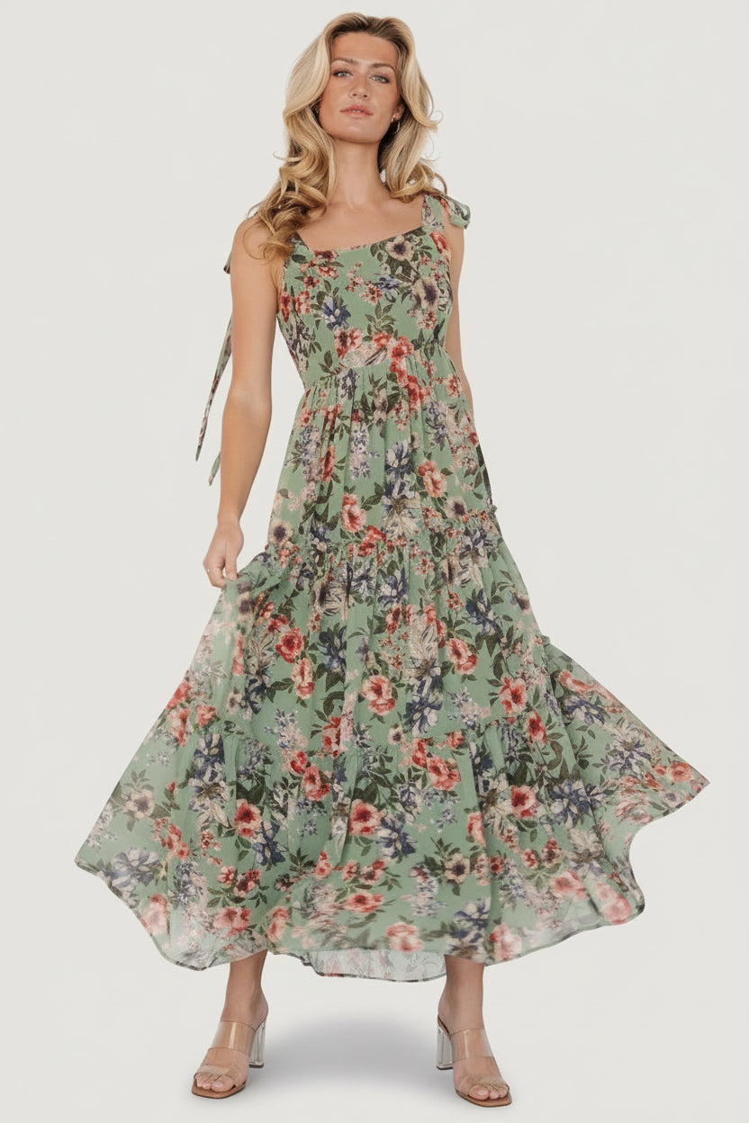 Front view of Anita Maxi Dress in green multi floral, chiffon overlay, square neckline, smocked back, and three ruffled tiers for flowy movement.