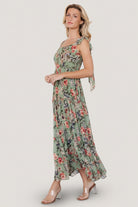 Flat-lay/detail image of Anita Maxi Dress fabric and print, showing green multi floral pattern, ruffle tiers, and chiffon texture close-up.