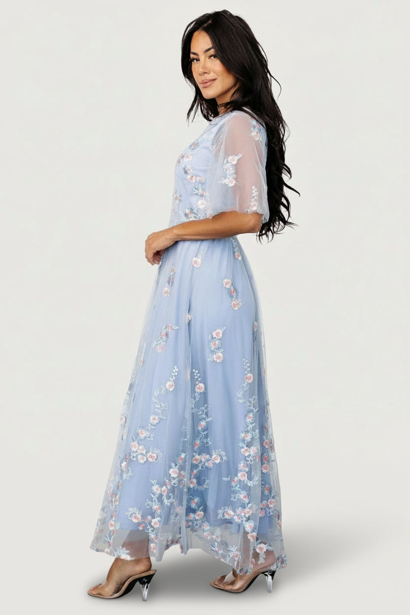 Back view of Arabella dress highlighting elasticated waist, keyhole closure, and multiple tulle layers for volume.