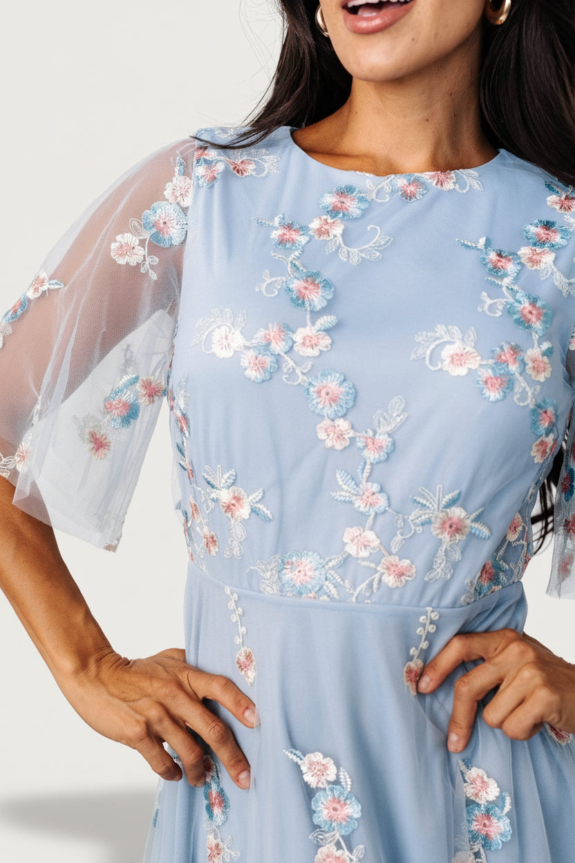 Sheer short sleeve and keyhole back detail on Arabella dress, showing single-button closure and lined bodice.
