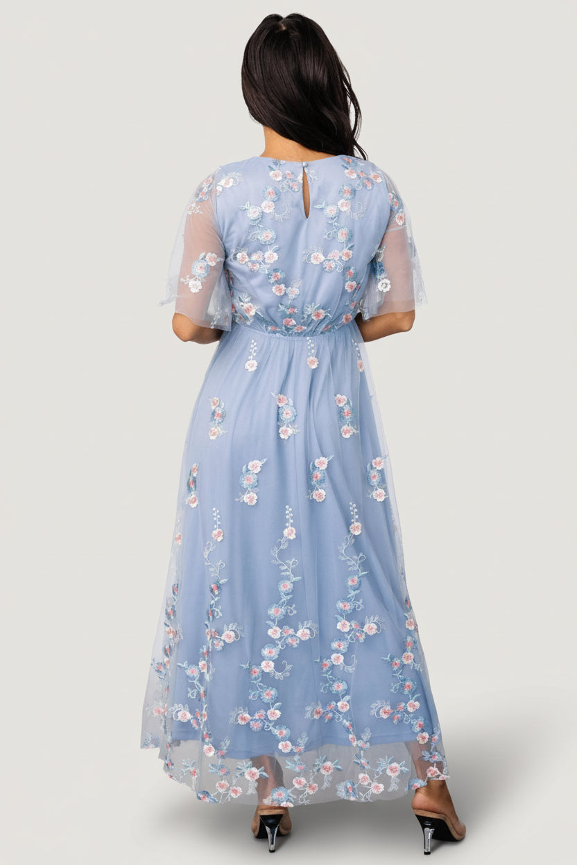 Styled on model: Arabella light blue and blush maxi dress with full skirt and soft drape, suitable for weddings and special occasions.