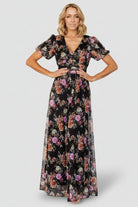 Close-up of Ardley Maxi Dress fabric and embroidered pattern on black multi floral mesh overlay with visible floral motifs.