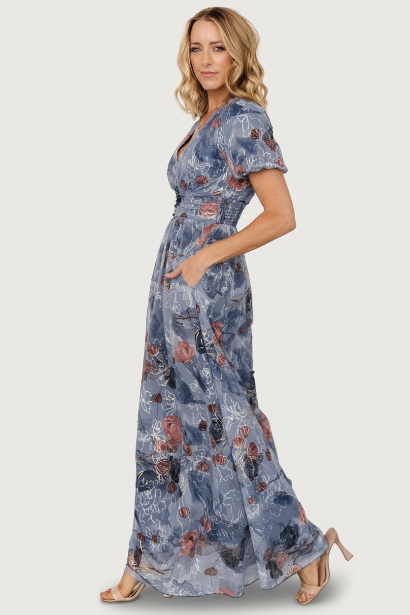 Back view of Ardley Maxi Dress in Slate Print showing maxi-length skirt, flow and full lining for coverage with embroidered tulle detail.