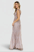Model wearing the Arlene gown, showing fit at banded waist and length to the floor; model is 5'9" wearing size S.