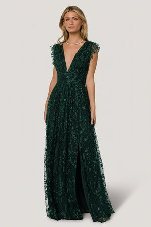 Front view of Arlene Shimmer Gown in emerald showing deep V-neck, shimmer tulle overlay, glittered floral sequin pattern, and high-waisted silhouette.