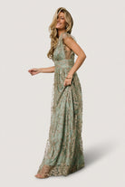 Back view of the Arlene Shimmer Gown in sage and gold showing the deep V back bodice and hidden zipper with hook-and-eye closure.