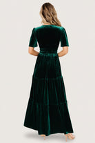 Close-up of short flutter sleeve and velvet texture on the Artemis emerald maxi dress, with subtle sheen and rich color.