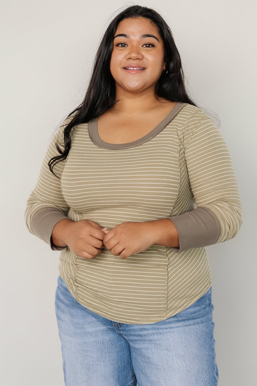 Close-up of fabric texture and stripe pattern highlighting soft knit, stretch fibers and neat seaming at the front.