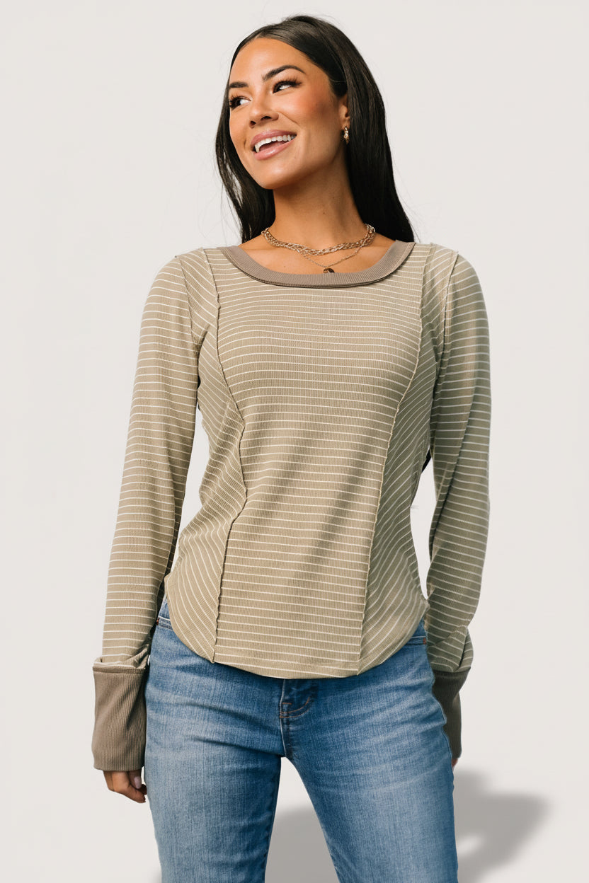Flat-lay view of olive stripe top highlighting round neckline, cuff contrast, and horizontal white stripe pattern.