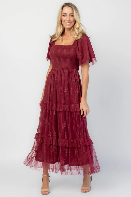 Auden Lace Midi Dress in Wine with square neckline, smocked bodice, and ruffle tiered skirt.