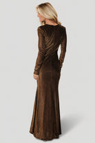 Detail shot of the long sheer fitted sleeve and cuff area, showing the delicate unlined sleeve and smooth seam finishes.