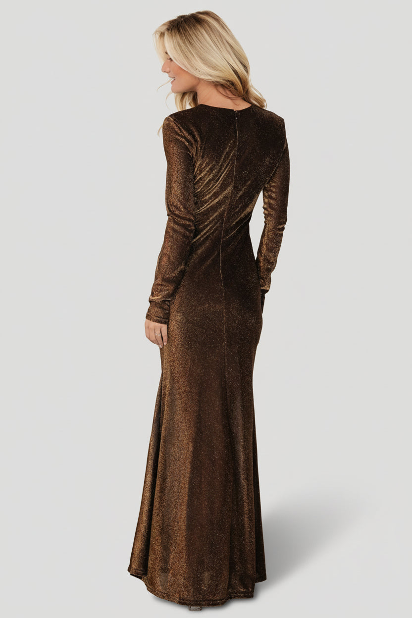 Detail shot of the long sheer fitted sleeve and cuff area, showing the delicate unlined sleeve and smooth seam finishes.