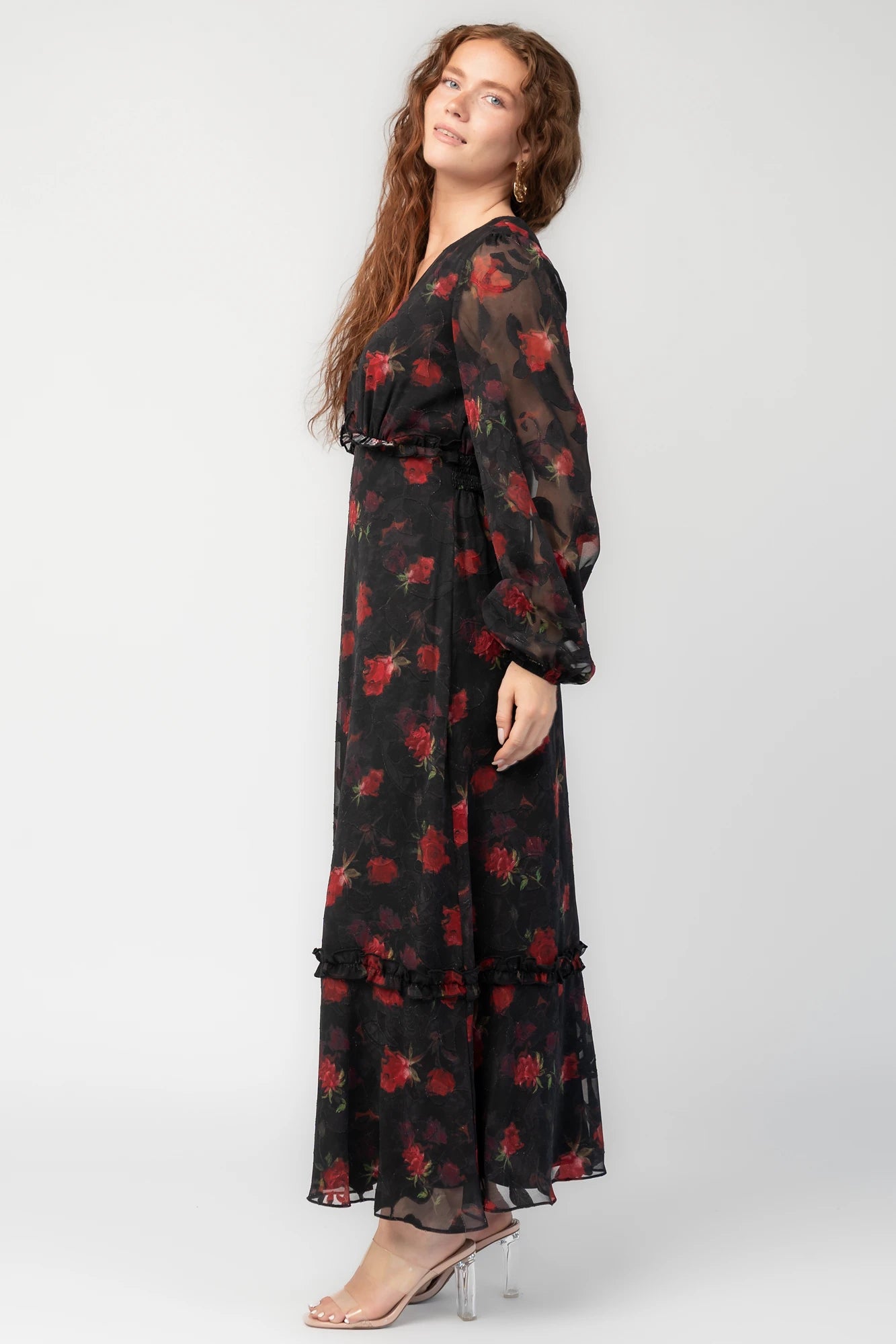 Avalora Midi Dress in Black Rose Floral with V-neckline, sheer long sleeves, smocked waist, and ruffle tier.