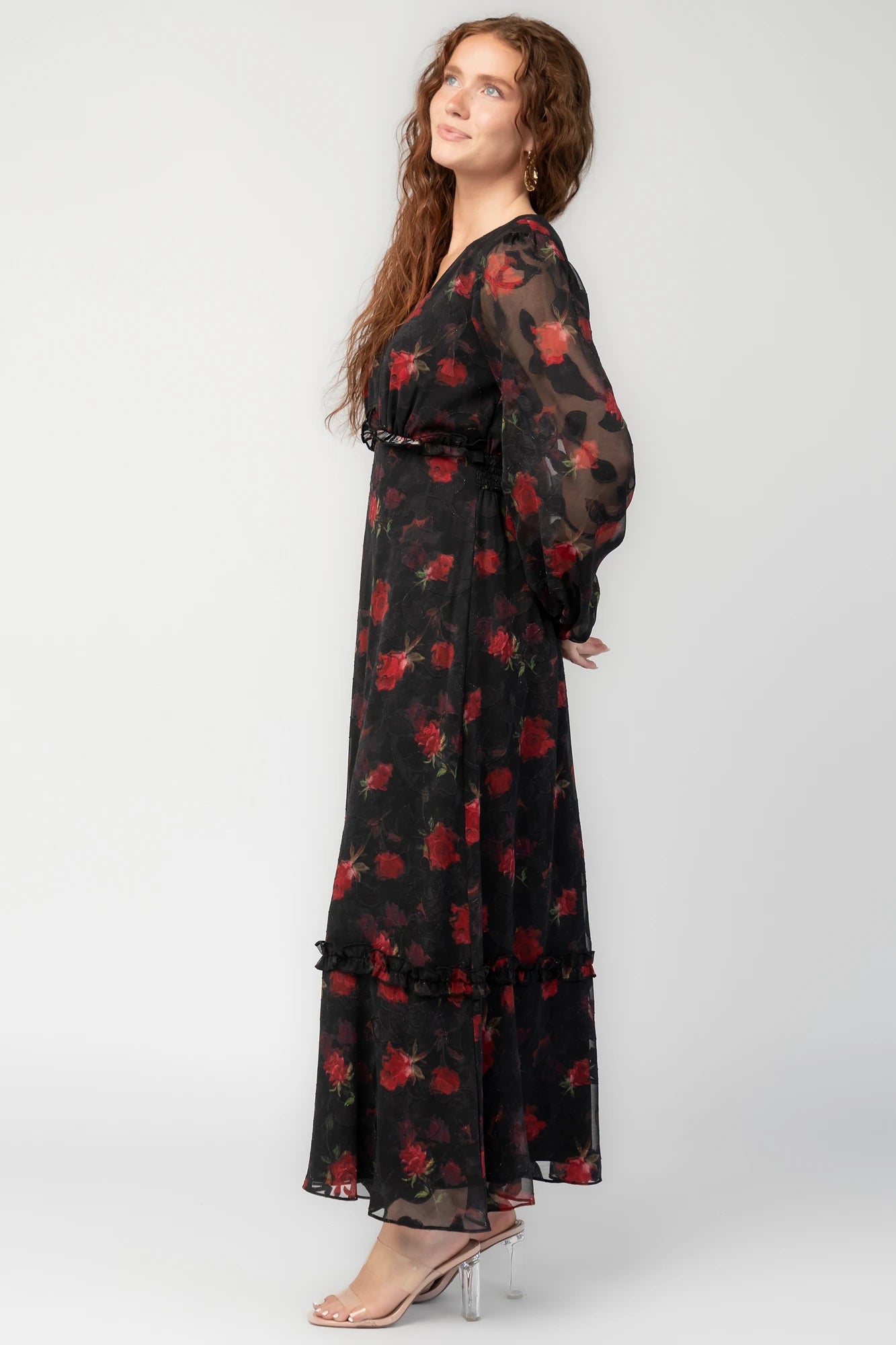 Avalora Midi Dress in Black Rose Floral with V-neckline, sheer long sleeves, smocked waist, and ruffle tier.