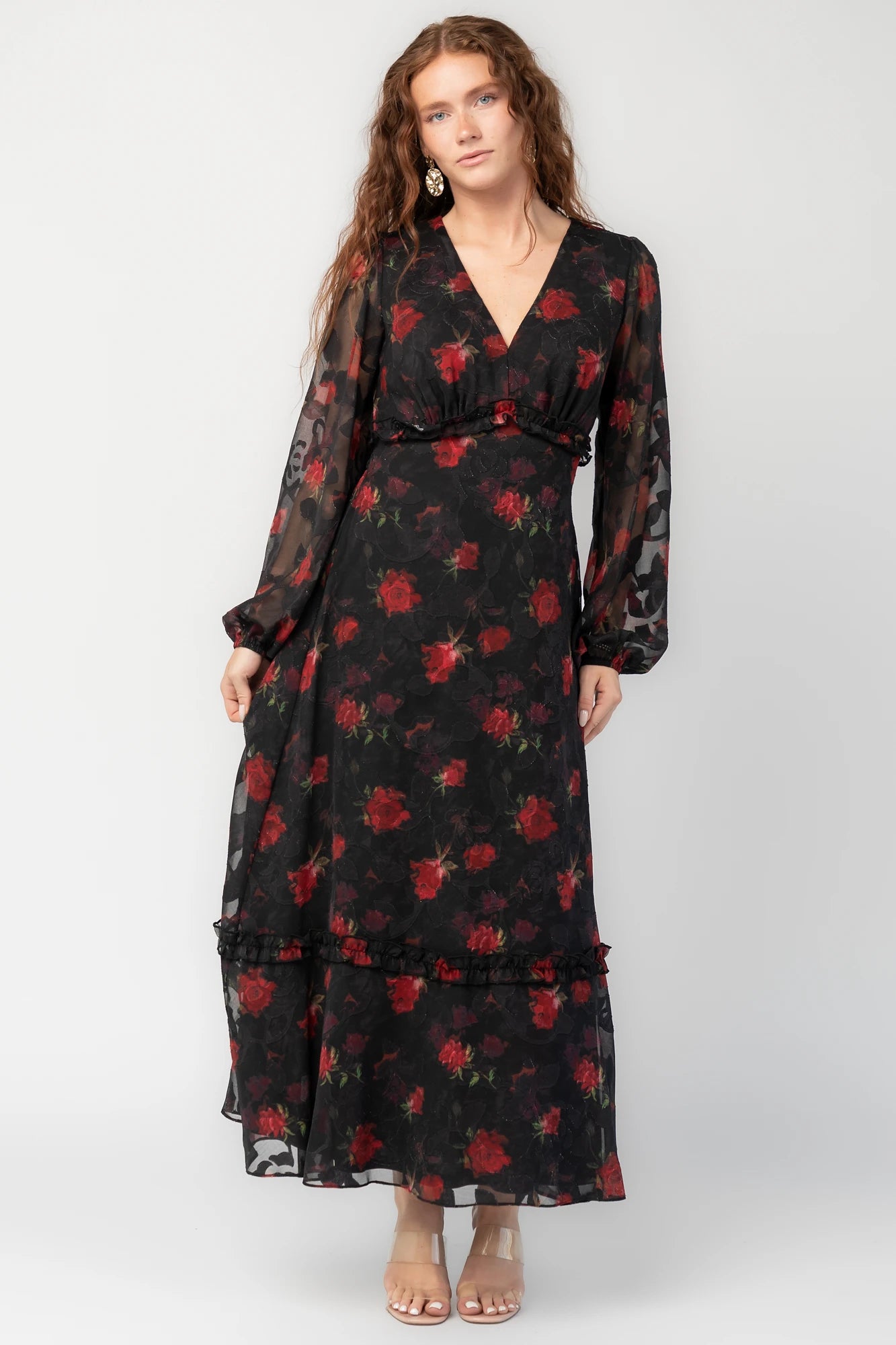 Avalora Midi Dress in Black Rose Floral with V-neckline, sheer long sleeves, smocked waist, and ruffle tier.