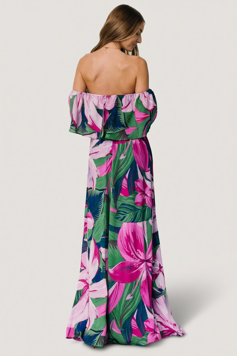 Detail of fabric and print on Azalea dress: close-up of green chiffon with fuchsia floral pattern, showing texture and color saturation.