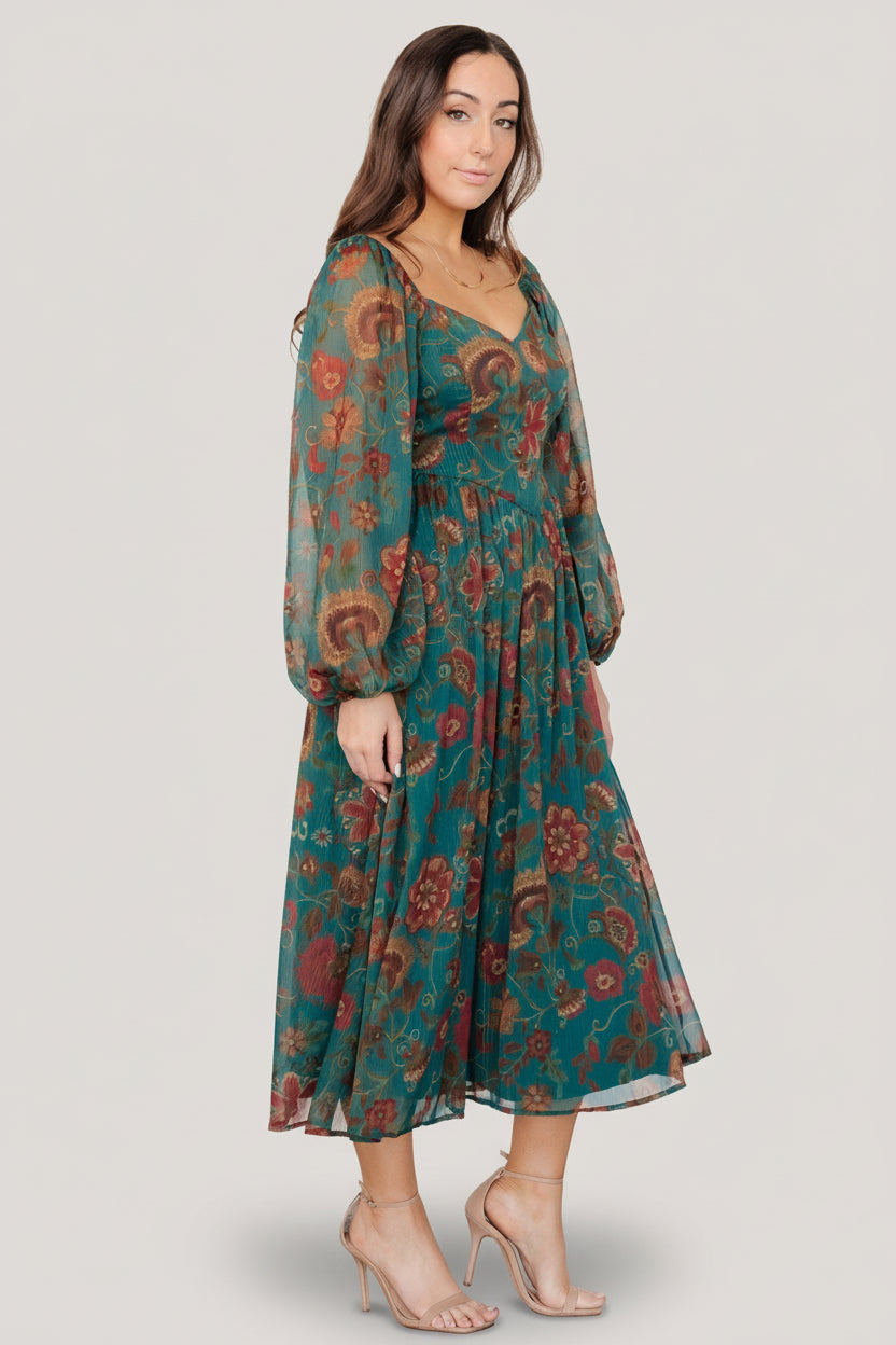 Detail of the sweetheart neckline and descending point bodice on the Babette Basque Waist midi dress in teal multi floral.