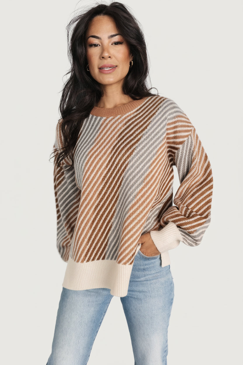 Back view of Baldwin striped sweater in multi-color showing full stripe pattern, ribbed hem, and relaxed fit that layers easily over tops.
