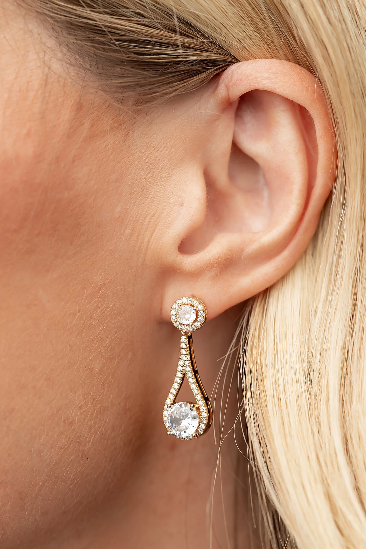 Balini Pave Drop Earrings in Gold with round clear stones, pavé detailing, and elegant teardrop drops.