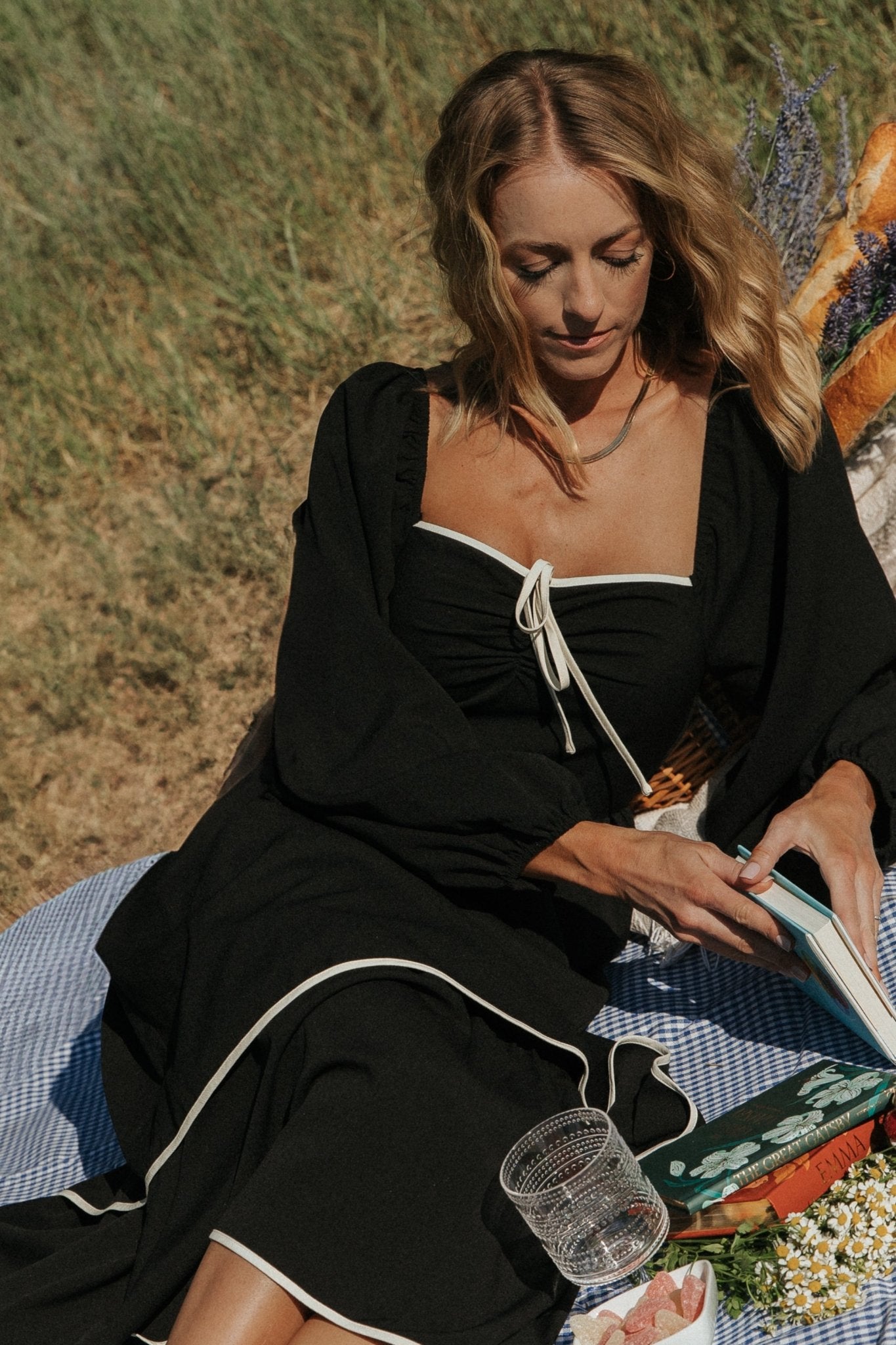 Detail shot of raglan cut balloon sleeve with elastic cuff and unlined sleeve fabric, highlighting silhouette and movement.