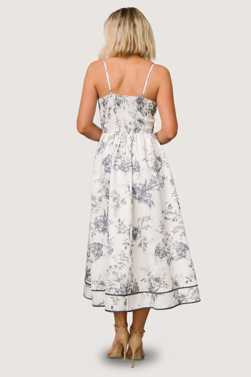 Close-up of Bellagio dress fabric and slate floral print, highlighting the V-neck fabric overlay and texture.