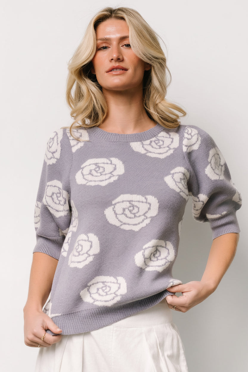 Styled look of dusty lavender sweater top paired with jeans, highlighting the midweight knit, floral print, and bubble sleeve silhouette.