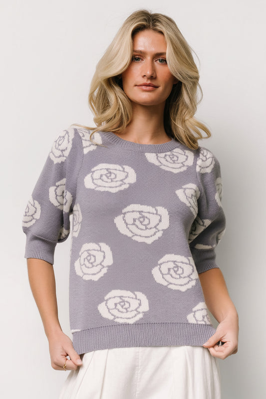 Front view of dusty lavender sweater top with cream floral print, bubbled half sleeves, round neckline, ribbed cuffs and hem in a soft stretch knit.