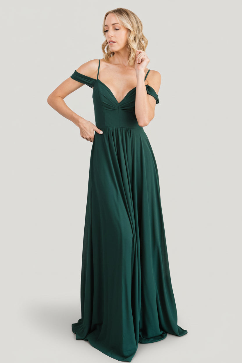 Close-up of front bodice gathering and built-in structured cups on the emerald lace maxi dress, highlighting texture and shape.