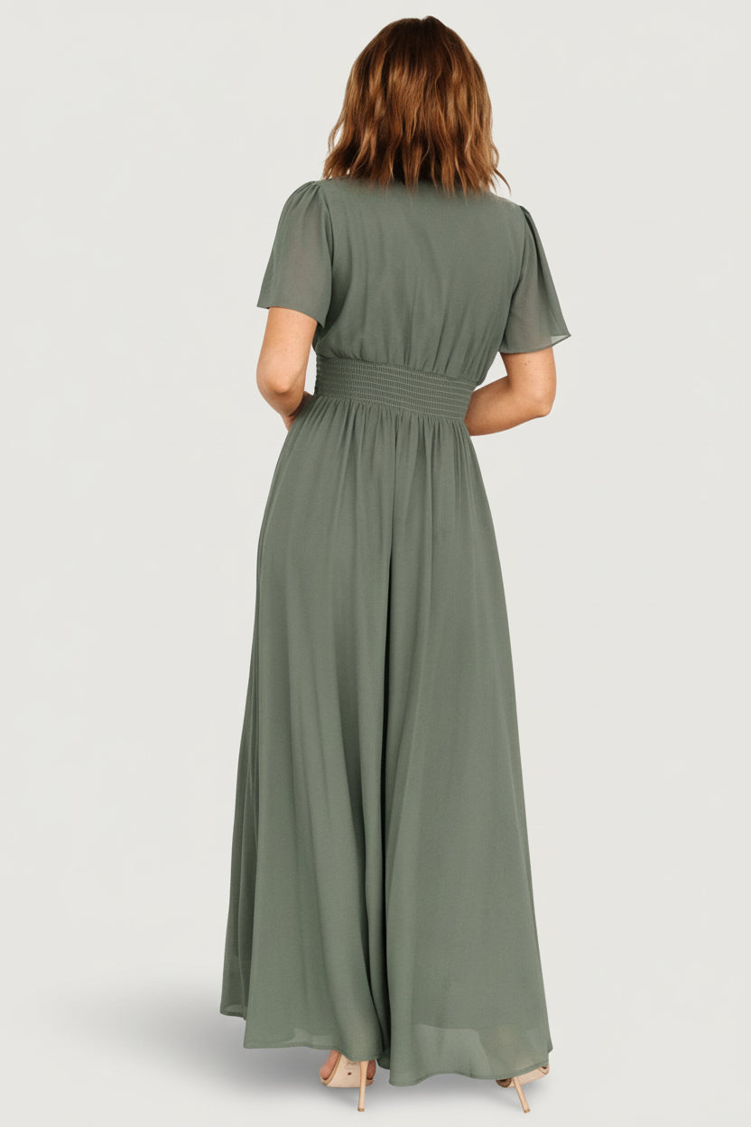 Close-up of smocked waist and gathered detail on Birdie Maxi Dress in dark sage, highlighting chiffon texture and lining under the bodice.