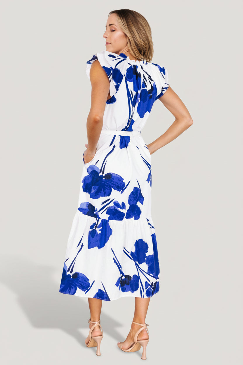 Styled outfit shot of the printed midi dress with removable waist tie visible, demonstrating casual yet polished summer styling.