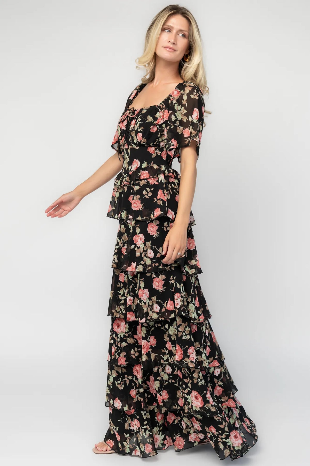 Bliss Tiered Maxi Dress in Black Multi Floral with square neckline, flutter sleeves, smocked back, and tiered maxi skirt.