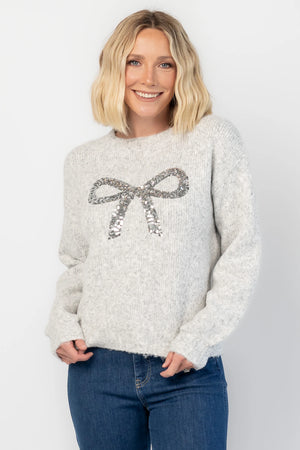 Bow Sweater in Gray with a sparkling sequin bow at the front, a crew neckline, and a heathered knit finish.