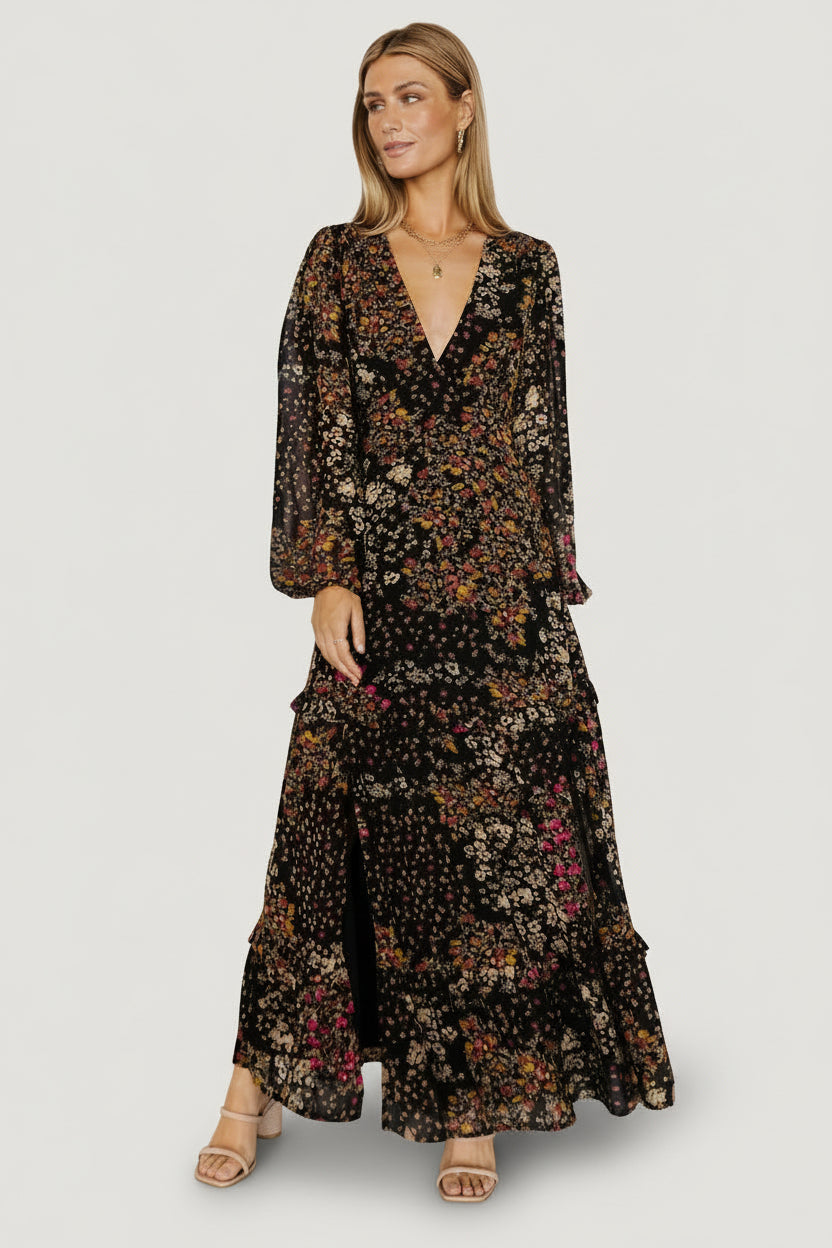 Detail shot of ruffle-tiered skirt and multi-colored floral print on lightweight chiffon-style polyester fabric.