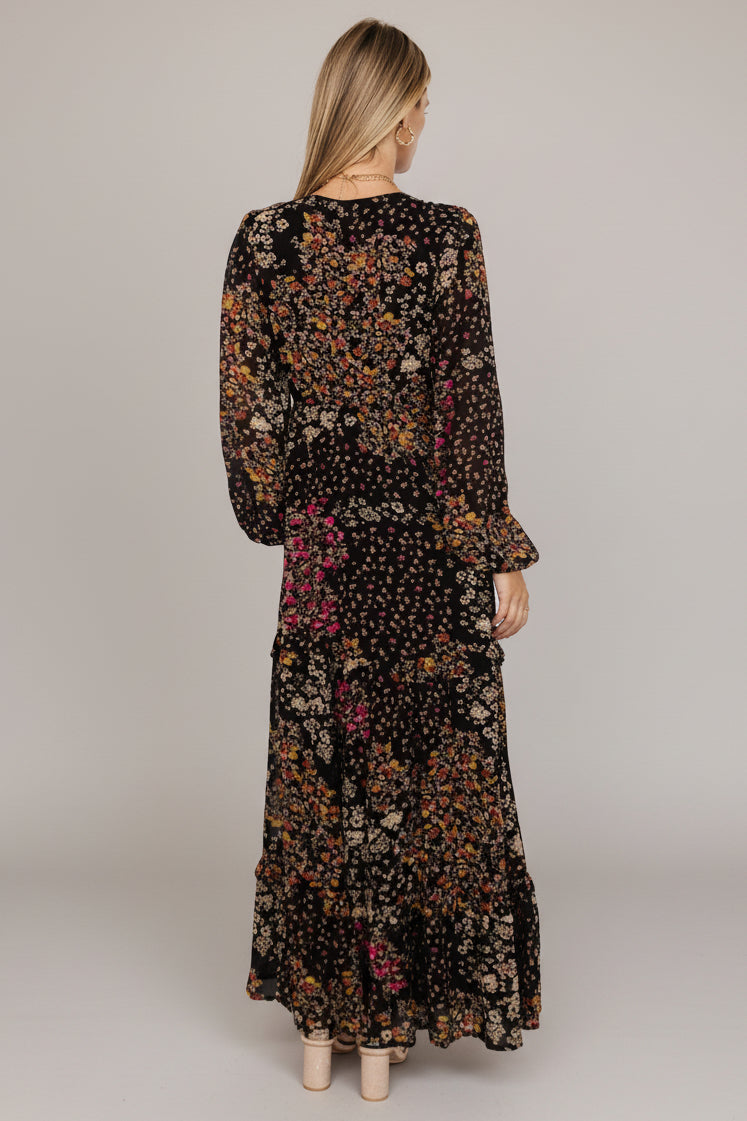 Close-up of bodice and deep V-neckline showing fabric texture and lining details of the Black Multi floral maxi dress.