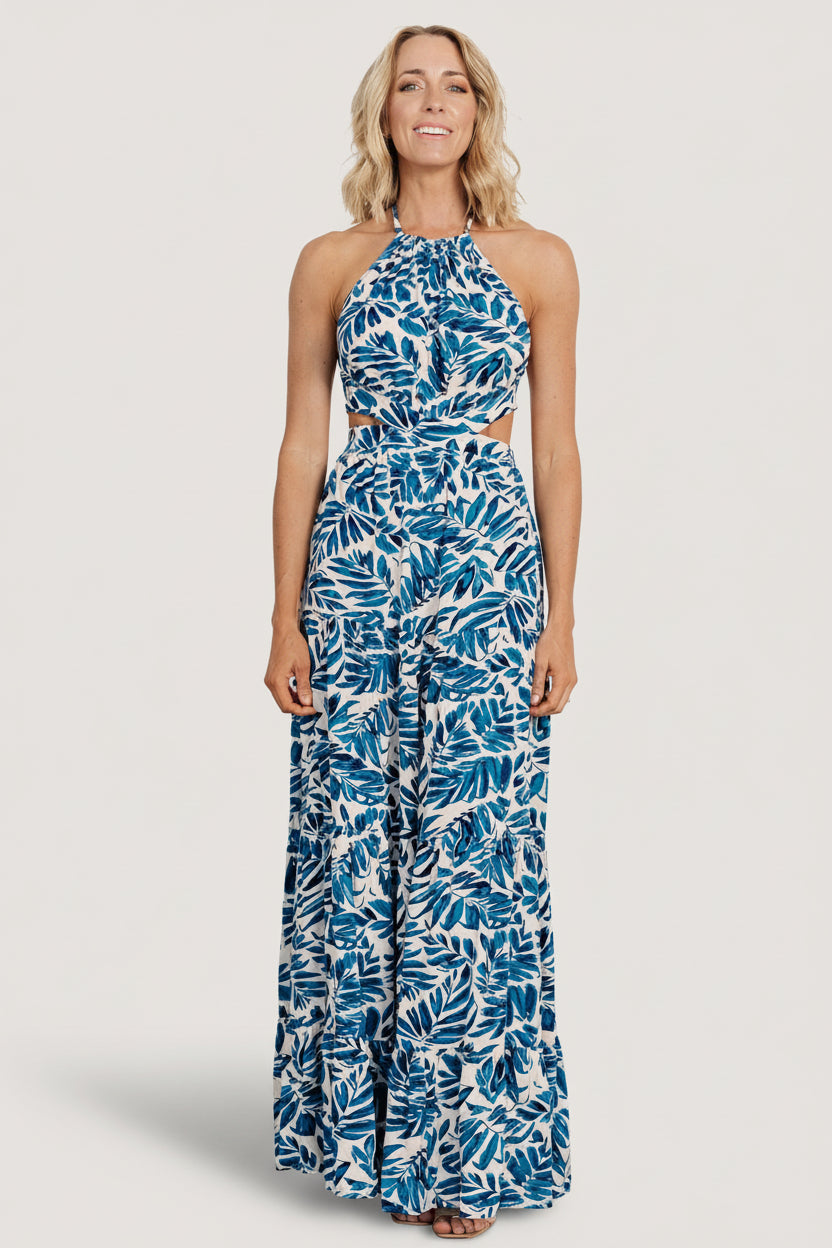 Detail photo of skirt movement and hemline on the cobalt print halter maxi, showing drape and lightweight rayon fabric.
