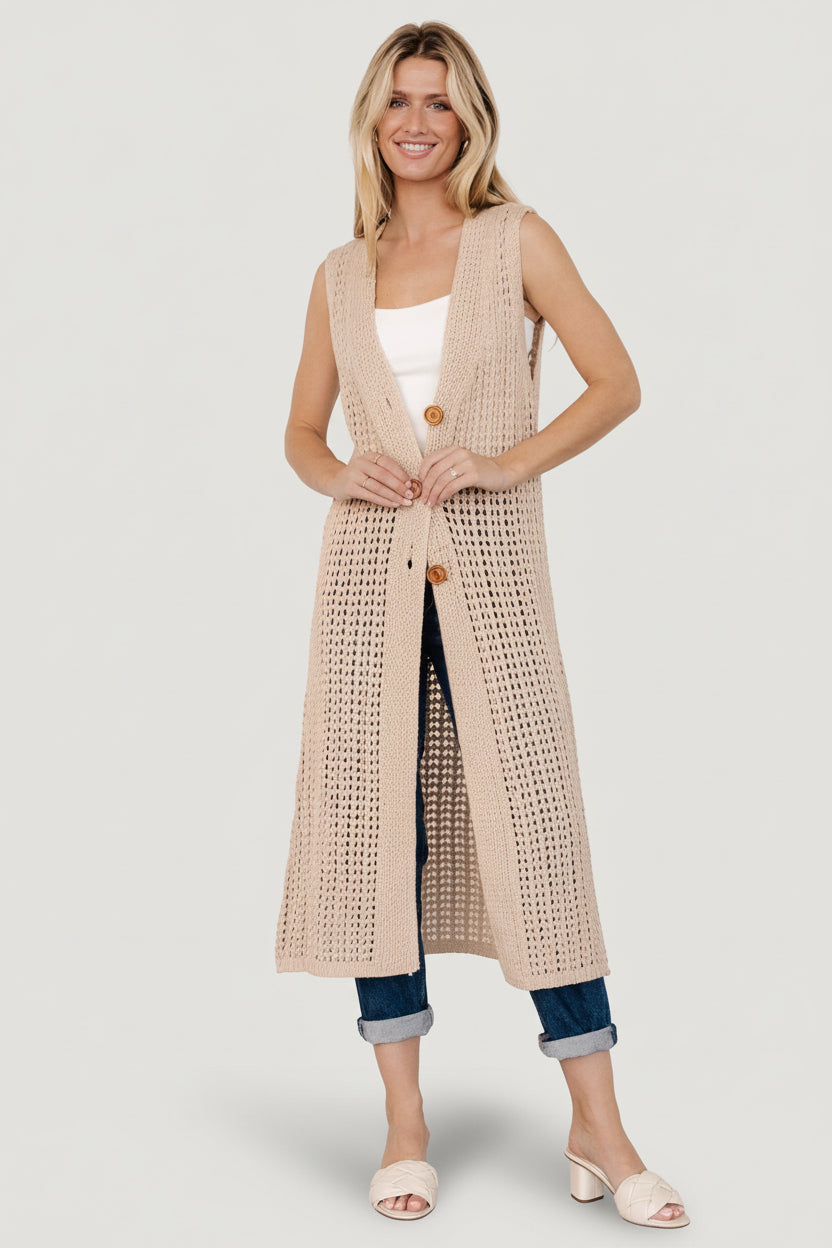 Detail shot of the open chunky knit and stitch pattern on the Bretta Duster Vest, illustrating fabric texture and airy construction.