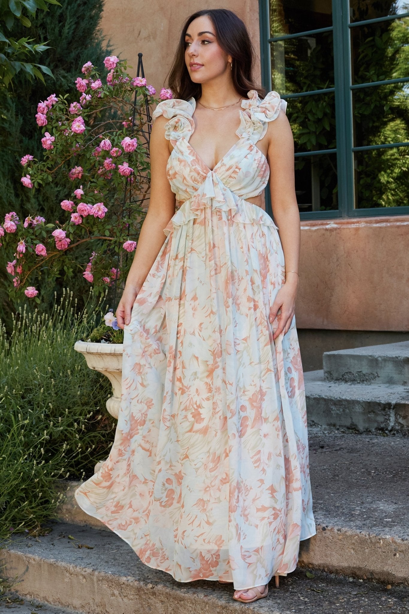 Fabric and hem detail of the Brigitta mint floral dress showing chiffon drape, print colors, and lined interior for smooth silhouette.