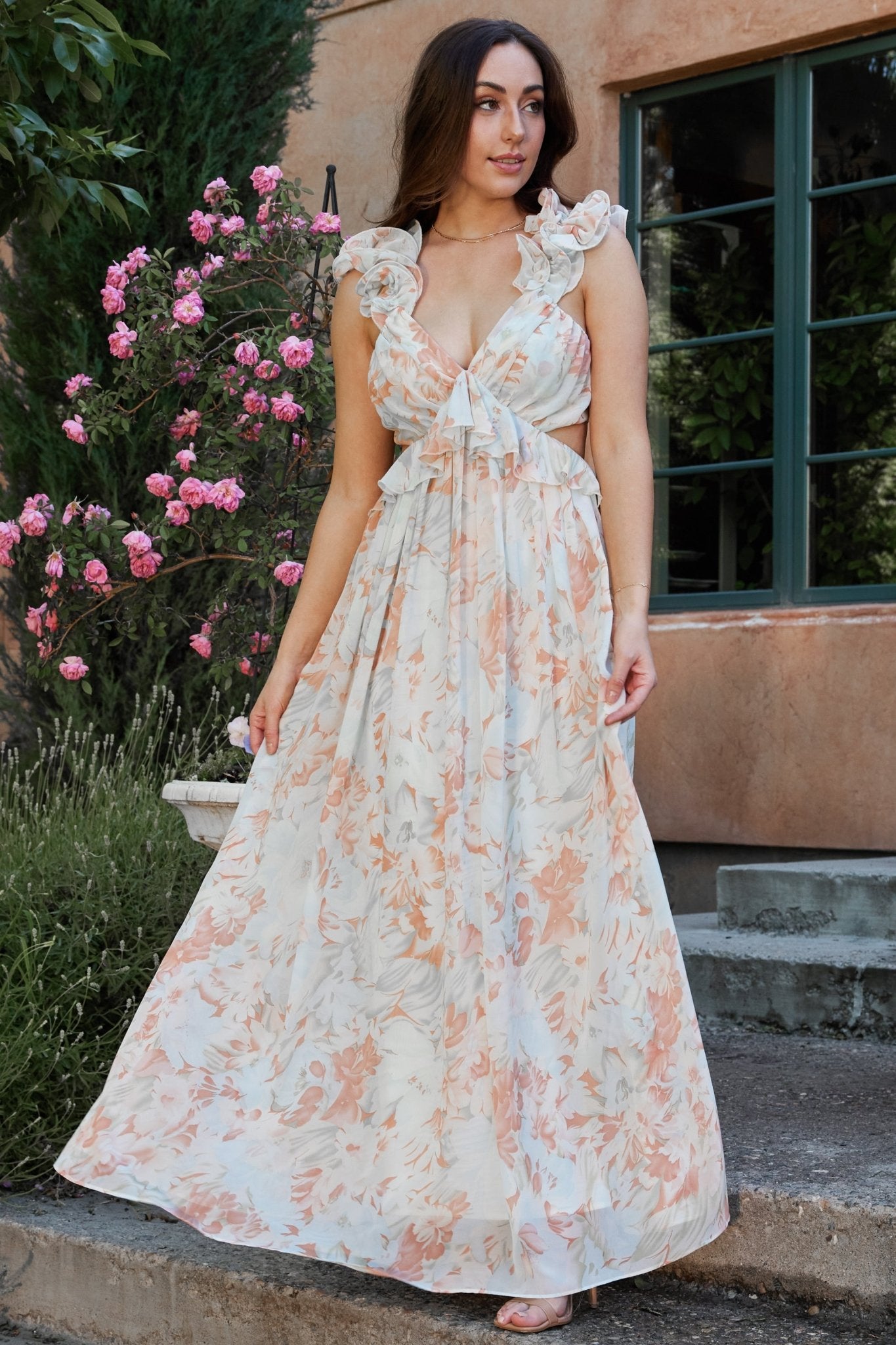 Back detail of Brigitta maxi dress showing open back with self-tie and hidden zipper, plus ruffle trim on mint floral chiffon fabric.