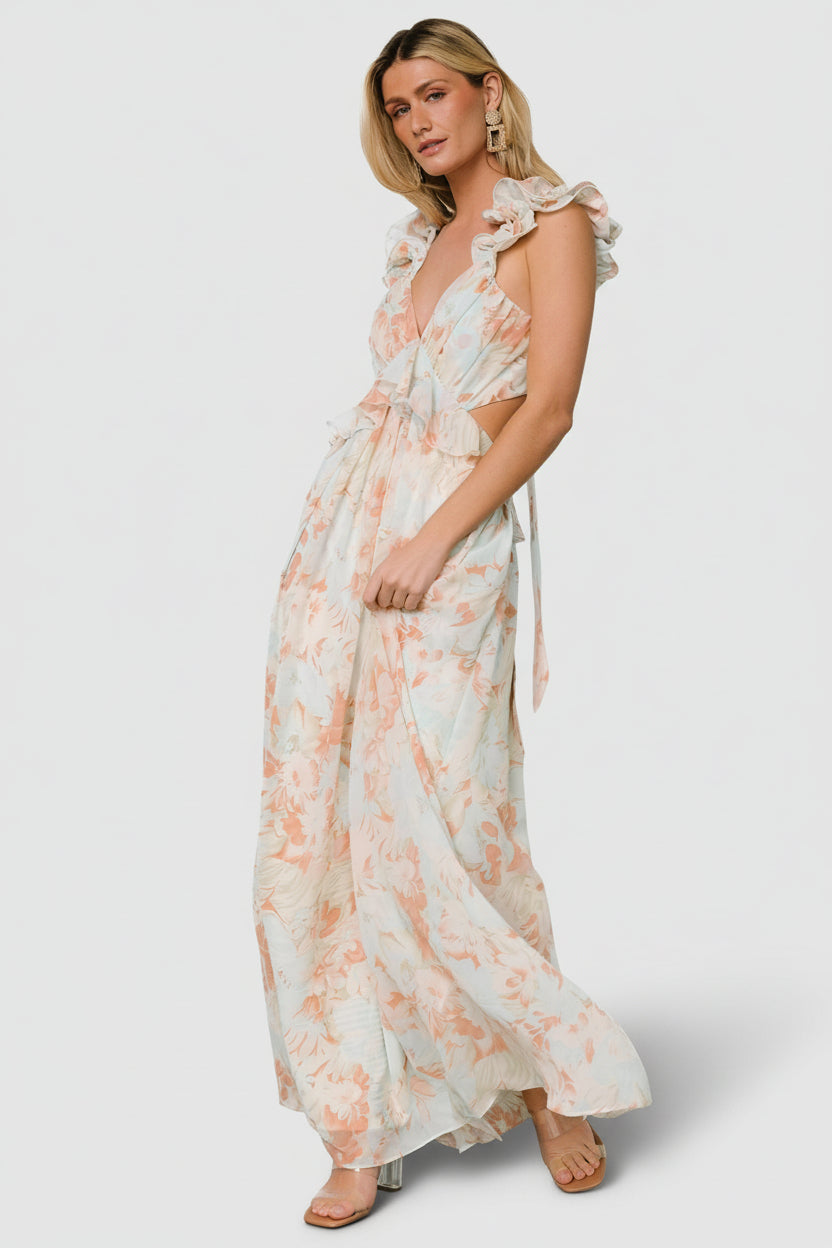 Side profile of Brigitta ruffled chiffon maxi dress in mint floral, displaying empire waist, flowy skirt, and delicate front ruffle detail.