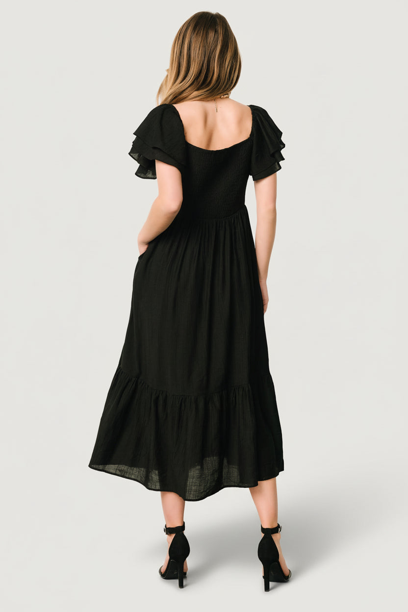 Back view showing smocked bodice and elastic at the back for moderate stretch and comfortable fit.