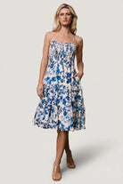 Detail image of tiered skirt and ruffled hem on Calina midi dress, showing movement and lightweight rayon-blend fabric.