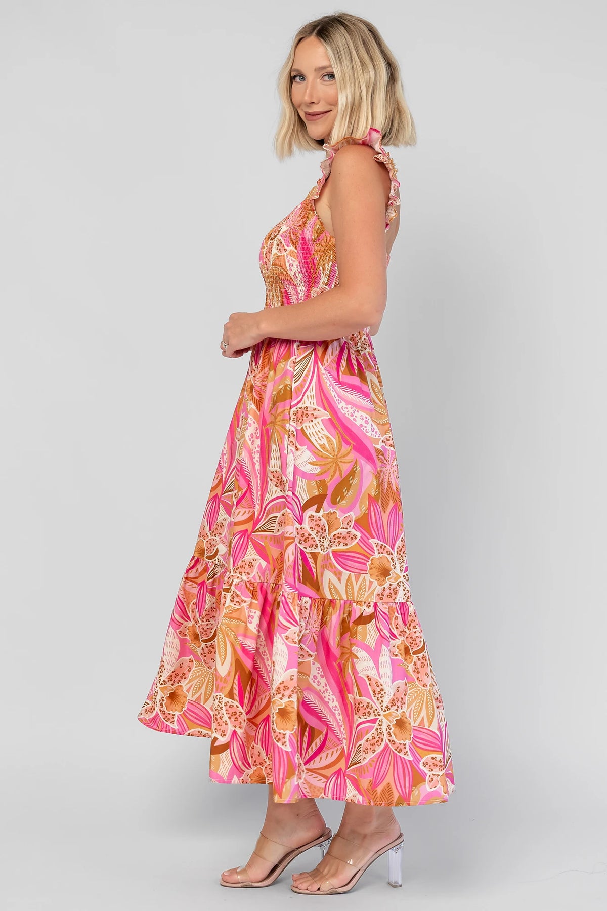 Carla Smocked Dress in Pink Multi with a smocked bodice, square neckline, ruffle straps, and a flowy midi skirt.