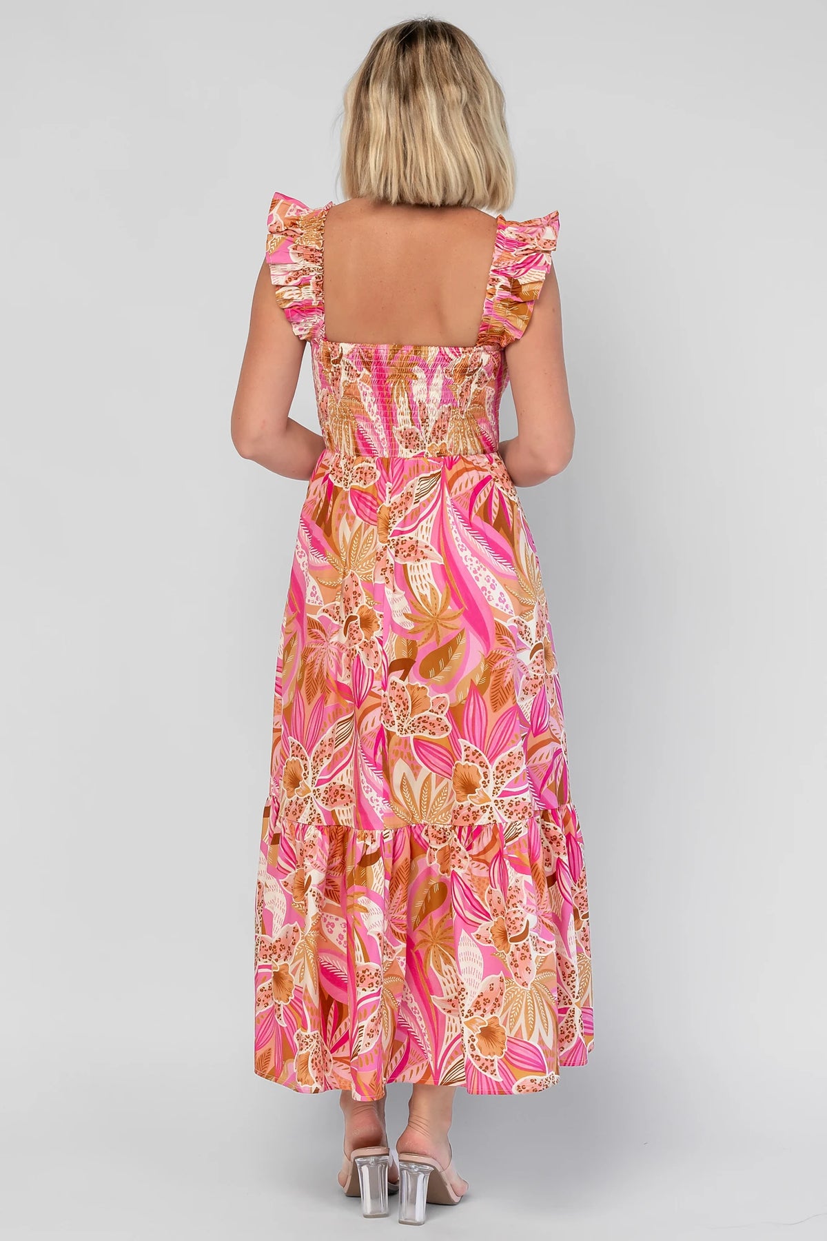 Carla Smocked Dress in Pink Multi with a smocked bodice, square neckline, ruffle straps, and a flowy midi skirt.