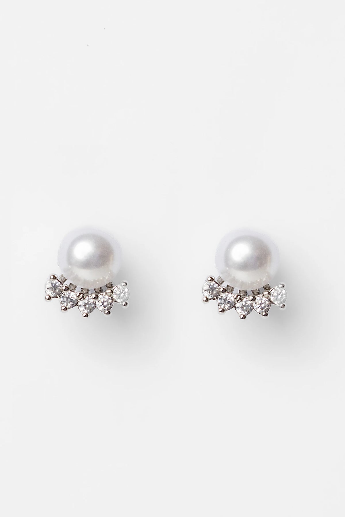 Carol Pearl Crown Stud Earrings in Silver with crown-inspired cubic zirconia and faux pearl.