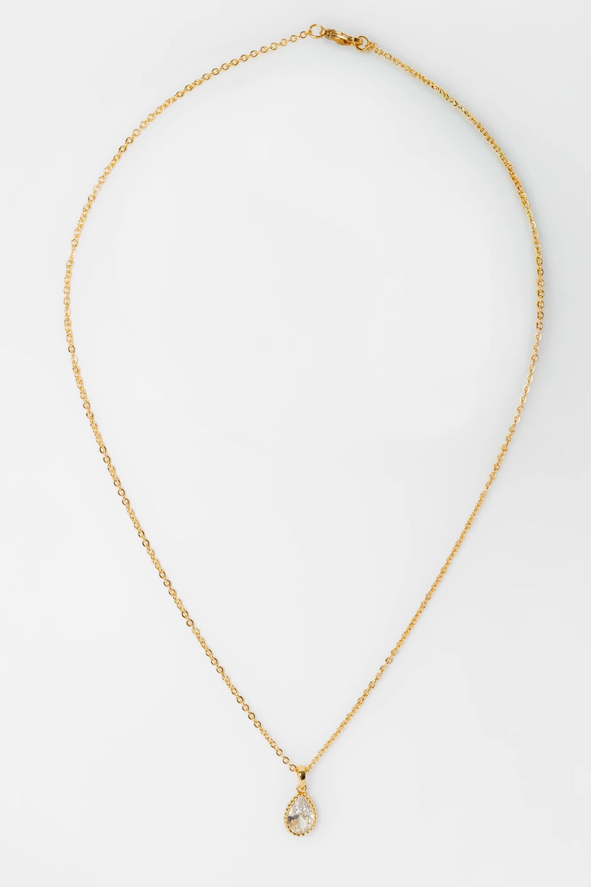 Christy Teardrop Pendant Necklace in Gold with sparkling teardrop-cut cubic zirconia pendant and delicate gold-tone chain.