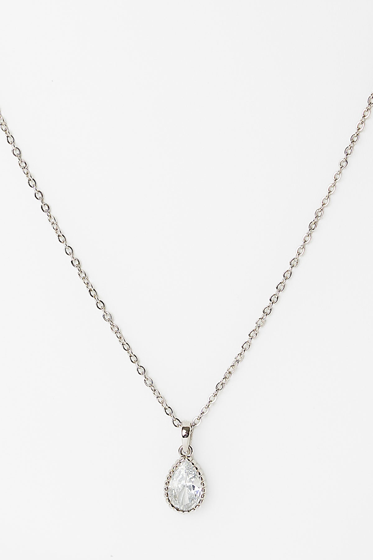 Christy Teardrop Pendant Necklace in Silver with teardrop cubic zirconia pendant and delicate chain.