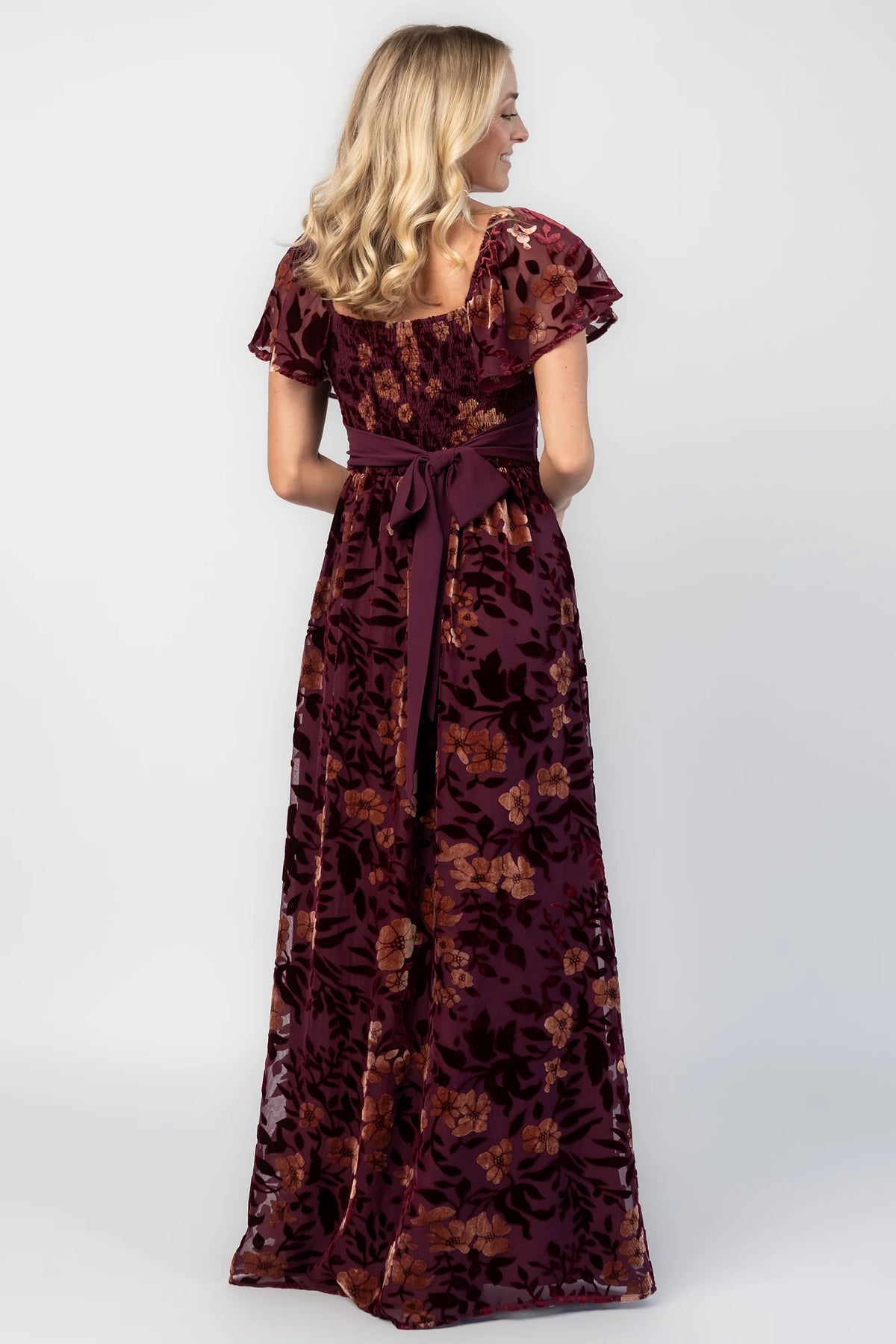 Clio Maxi Dress in Mulberry + Gold Floral with square neckline, flutter sleeves, and empire waist.