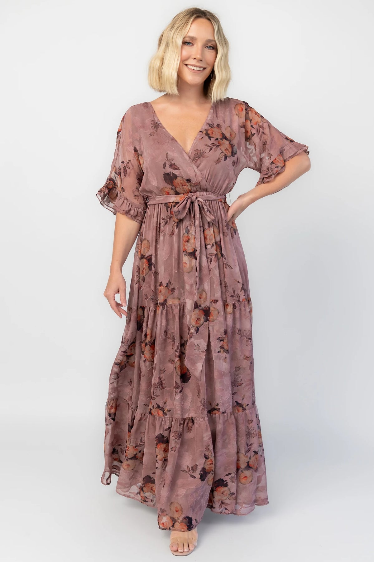 Cora Maxi Dress in Vintage Mauve Floral with V-neckline, flutter sleeves, and tiered maxi skirt.