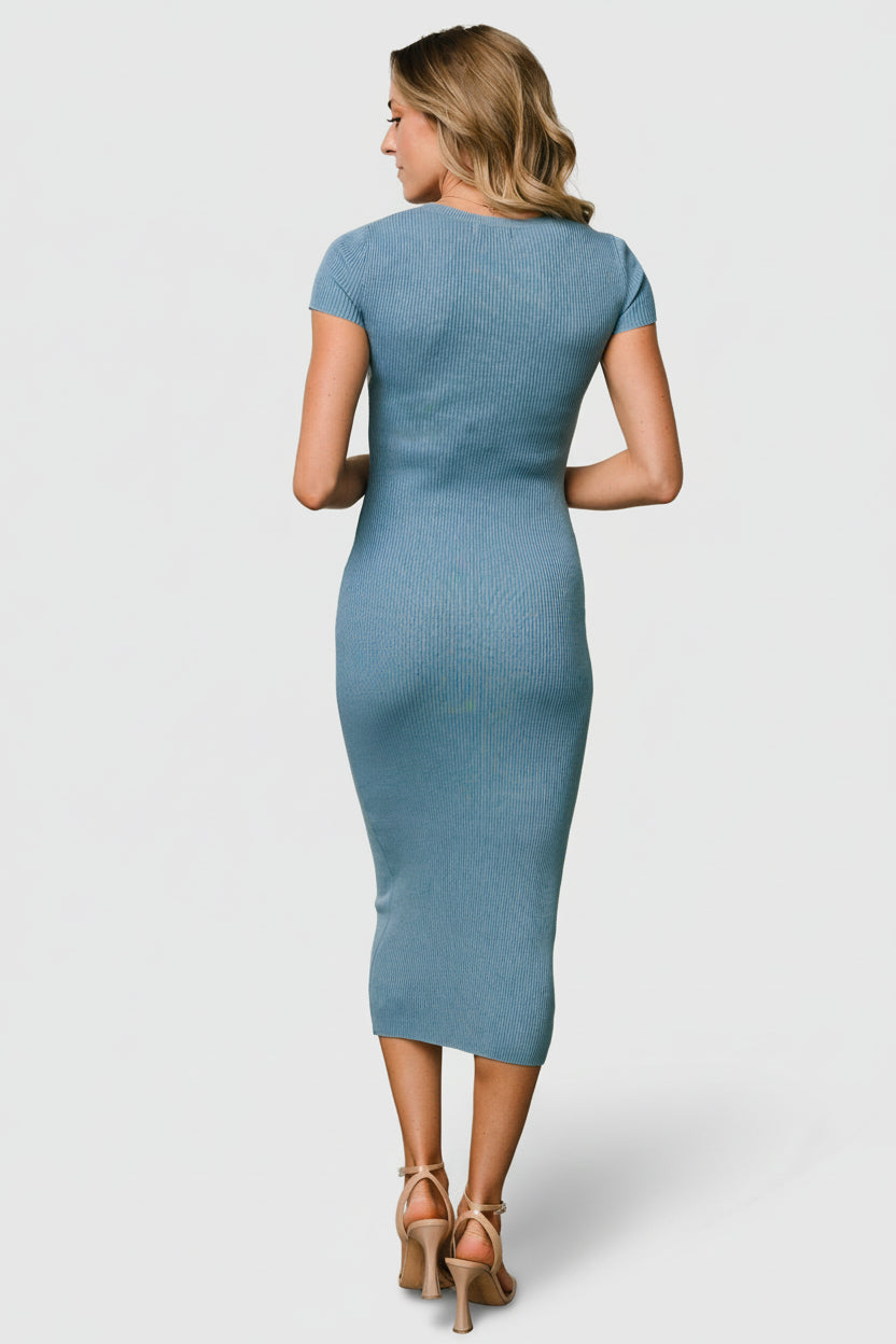 Flat-lay of Dana ribbed midi dress in dusty blue, folded to show jewel neckline, rib texture, and overall streamlined shape.