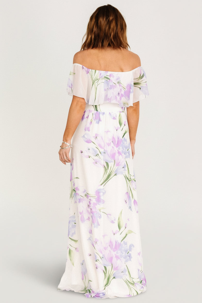 Close-up of ruffled elastic off-shoulder neckline and floral print on lightweight chiffon for the Daphne maxi dress.